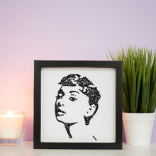 Load image into Gallery viewer, Portrait of Audrey Hepburn in a black frame