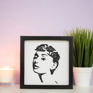 Portrait of Audrey Hepburn in a black frame 