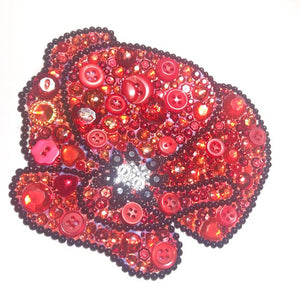 Red sparkly poppy button art framed picture.