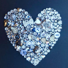 Load image into Gallery viewer, silver sparkly heart button art on black background. Framed picture.