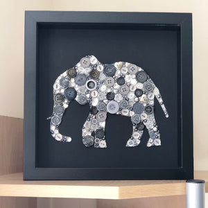 Button art elephant on black. Ivory anniversary framed picture.